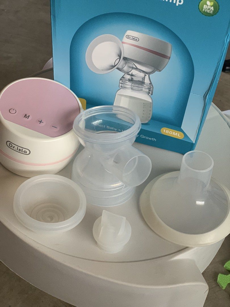 Dr. Isla EB11 Electric Breast Pump (Category: Breastfeeding & Bottle Feeding) located in Naga. Submitted by ashleydelpuerto_0 (Listing ID 1464809372, Image 1). Description: - Brand: Dr. Isla EB11 Electric Breast Pump - Color: White & Pink (Single Pack) - Settings: 9-speed adjustment for comfortable expression - Materials: 100% BPA-Free (ABS, PP, and silicone) - Inclusions: Main pump unit, breast shield, tee connector, silicone diaphragm, and duck