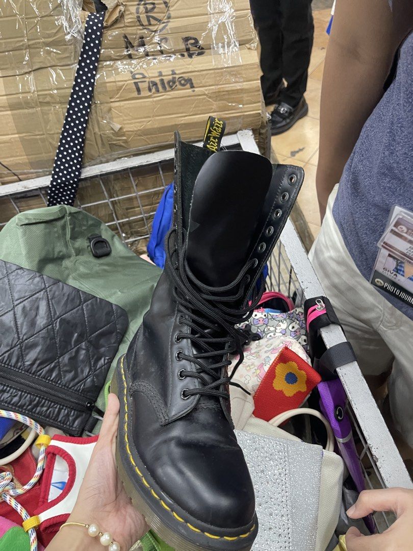 Dr. Martens Black Leather 14-Eye Boots (Category: Boots) located in Balanga. Submitted by crowjo (Listing ID 1464963870, Image 1). Description: - Brand: Dr. Martens - Style: Classic black leather 14-eye tall lace-up boots - Details: Iconic yellow stitching along the welt and traditional AirWair heel loop - Soles: Sturdy rubber soles with plenty of traction left - Condition: Smooth leather upper in great shape; shows typical light wear on the inte