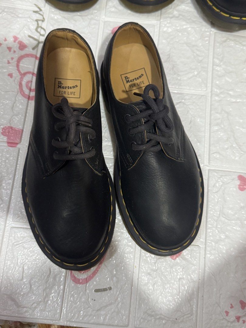 Dr. Martens Boots 100%Original (Category: Boots) located in Manila. Submitted by wildbear.e10374 (Listing ID 1464834041, Image 2). Description: - Authentic Dr. Martens footwear collection - Available styles: tall side-zip boots, classic lace-up boots, oxblood lace-up boots, and low-top shoes - Colors: Classic black and rich oxblood leather - Multiple sizes available - Features iconic yellow welt stitching - Air-cushioned rubber outsoles resistant