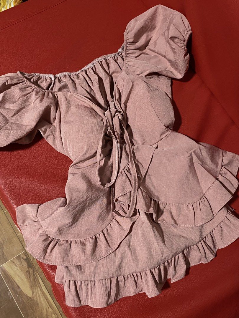 Dusty Pink Off-Shoulder Ruffle Blouse (Category: Blouses) located in Manila. Submitted by kik1sdservice (Listing ID 1464918025, Image 1). Description: s-m adjustable ung sa may ribbon sa thailand nabili padded, once lang nagamit no issue .