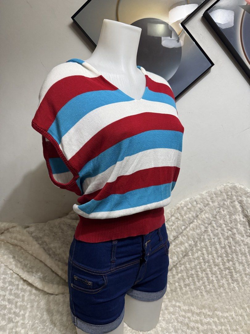 Ebase Striped V-Neck Knit Sweater Size M (Category: Others Tops) located in Marikina City. Submitted by lorradel (Listing ID 1464893648, Image 2). Description: - Brand: Ebase - Size: fits S-M - Color/Pattern: Red, white, and blue retro stripes - Design: V-neck, short cap sleeves, and fitted ribbed hem - Material: Lightweight, soft knit fabric - MAY HAVE some washable stains (hindi maiiwasan) needs washing; had been stored - mannequin size 34-26-3