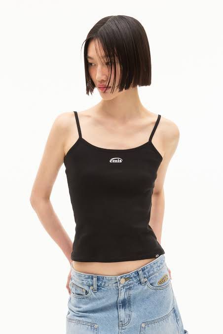 emis black camisole tank top (Category: Sleeveless) located in Manila. Submitted by xoxo_tine (Listing ID 1464791155, Image 1). Description: - Brand: Emis - Color: Black - Style: Slim fit camisole tank top with thin spaghetti straps - Material: Soft and stretchy cotton rib knit - Details: White embroidered Emis logo on the chest and small branded tag on the bottom hem - Versatility: Perfect everyday basic, easy to pair with denim or skirts.