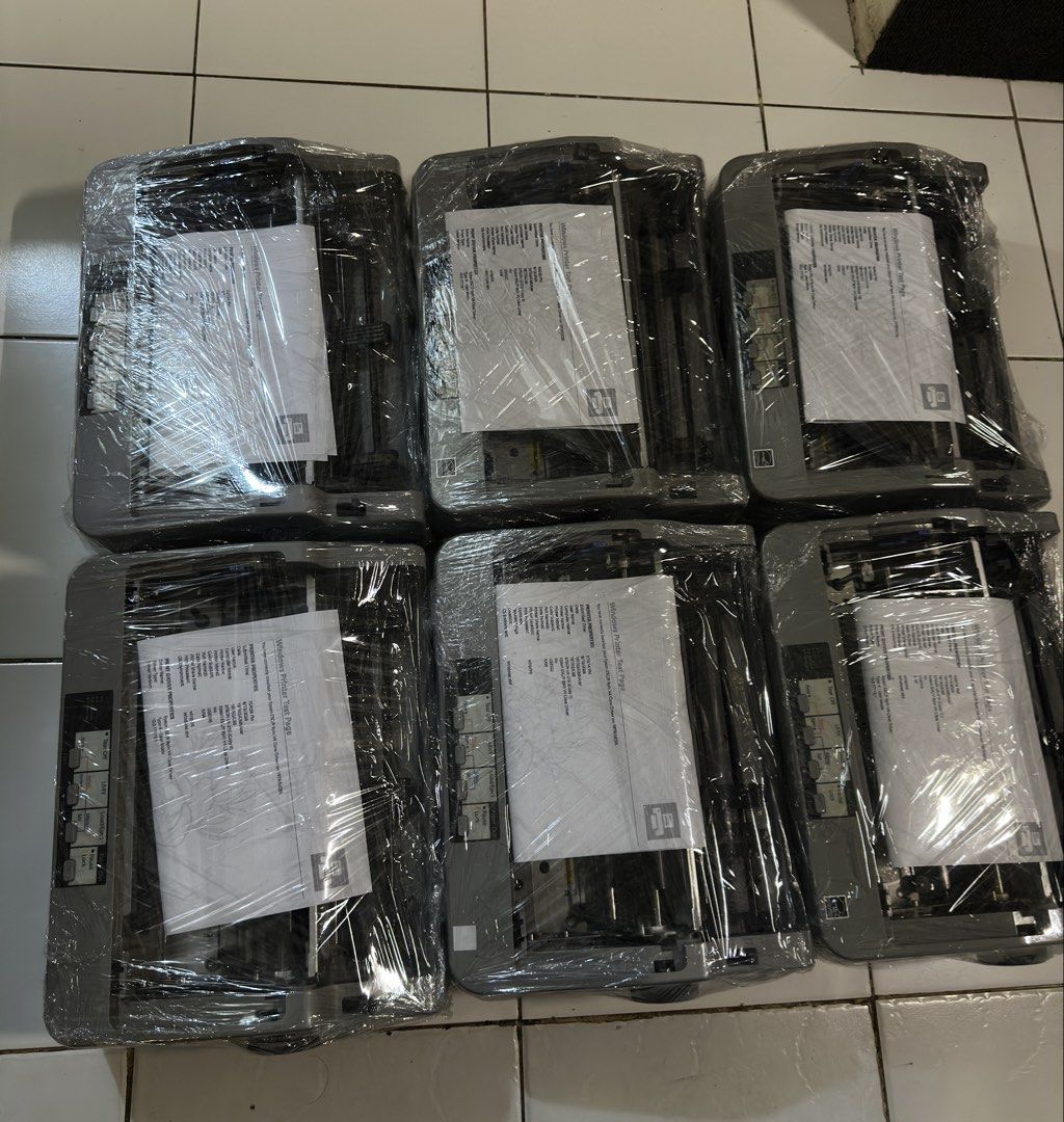 Epson Lx-310 Dot Matrix Printer (Category: Printers, Scanners & Copiers) located in Makati City. Submitted by jtechs (Listing ID 1464937394, Image 2). Description: - Lot of 6 dependable Epson dot matrix printers - Standard grey office design with front-right control panels - Tested and working: Windows printer test pages loaded on each unit - Wrapped in clear plastic for protection - Ideal bulk setup for businesses, offices, or industrial operati