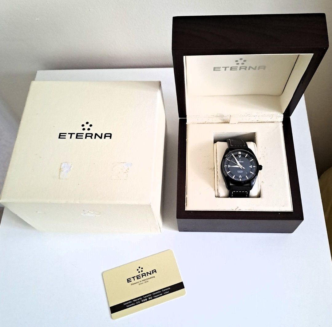 Eterna KonTiki Automatic Black Dial Watch （分類：手錶）位於 Hong Kong。 由 rjdave01 提交（商品編號 1464928413，圖片 2）。簡介： Eterna Adventure KonTiki automatic watch in black. Swiss made, 200m water resistant. Black dial with date window at 4 o'clock. Black leather strap with white stitching and signed buckle. Solid case back featuring the KonTiki raft relief. Original presentation box, outer cardboard box, and warranty card included.。