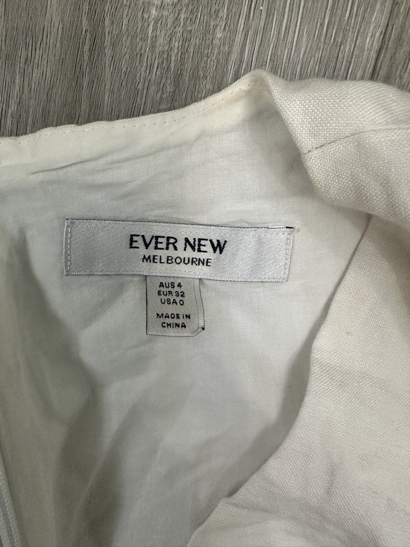 Ever New White Puff Sleeve Peplum Top (Category: Blouses) located in Manila. Submitted by itsarah (Listing ID 1464835327, Image 2). Description: Ever New Melbourne white top in AUS size 4, EUR 32, USA 0. Features short puff sleeves with elastic cuffs and a fitted peplum waist. Deep V-neckline wrap front style. Zip closure at the back. Clean white fabric, great for casual outings or dressing up for dinner..