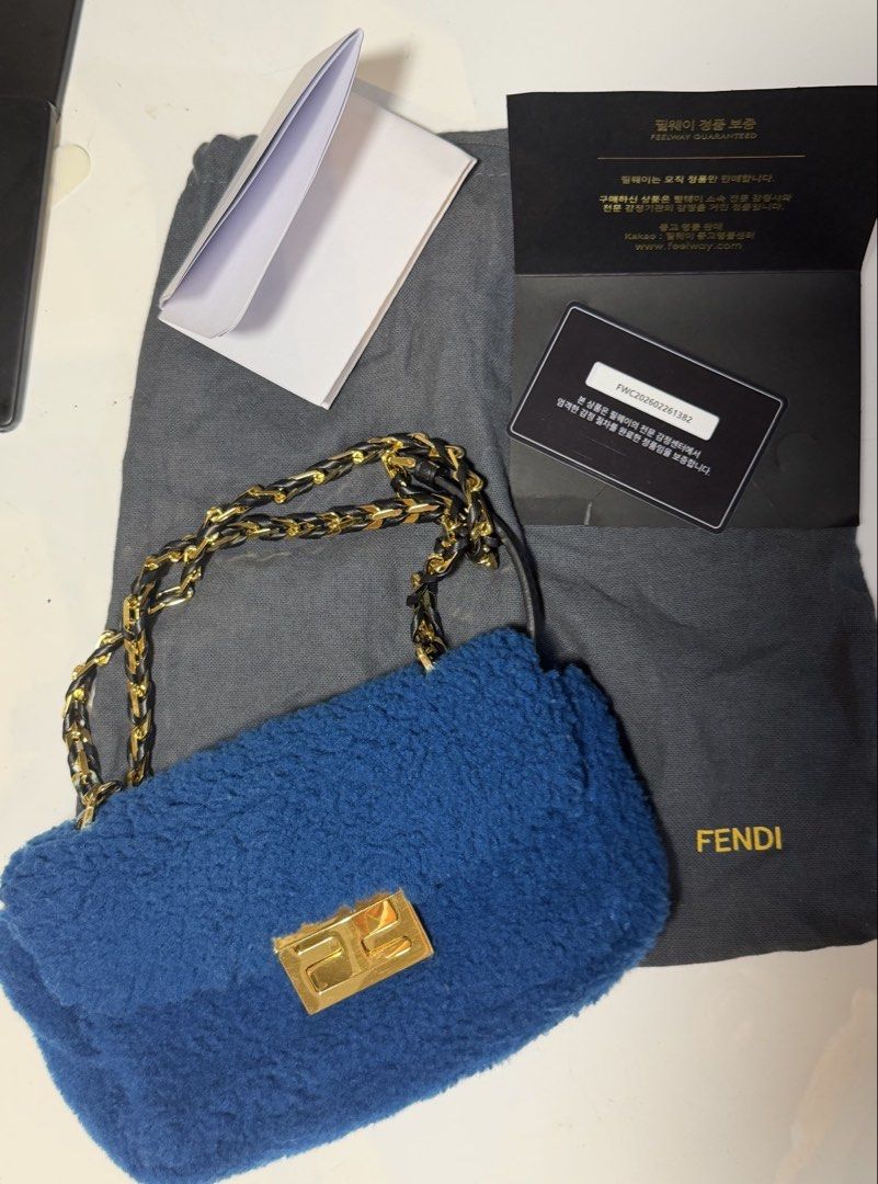 Fendi Blue Mini Baguette Shearling Bag w/ authenticity (Category: Luxury Bags & Wallets) located in Quezon City. Submitted by loveangelmusicbaby (Listing ID 1463915705, Image 1). Description: - Authentic Blue Fendi Bag with Authenticity card - 2 in 1 strap - Elegant Gold Chain Strap with Leather Accents - Iconic Fendi Logo Clasp - Includes Original Dust Bag - Made in Italy.