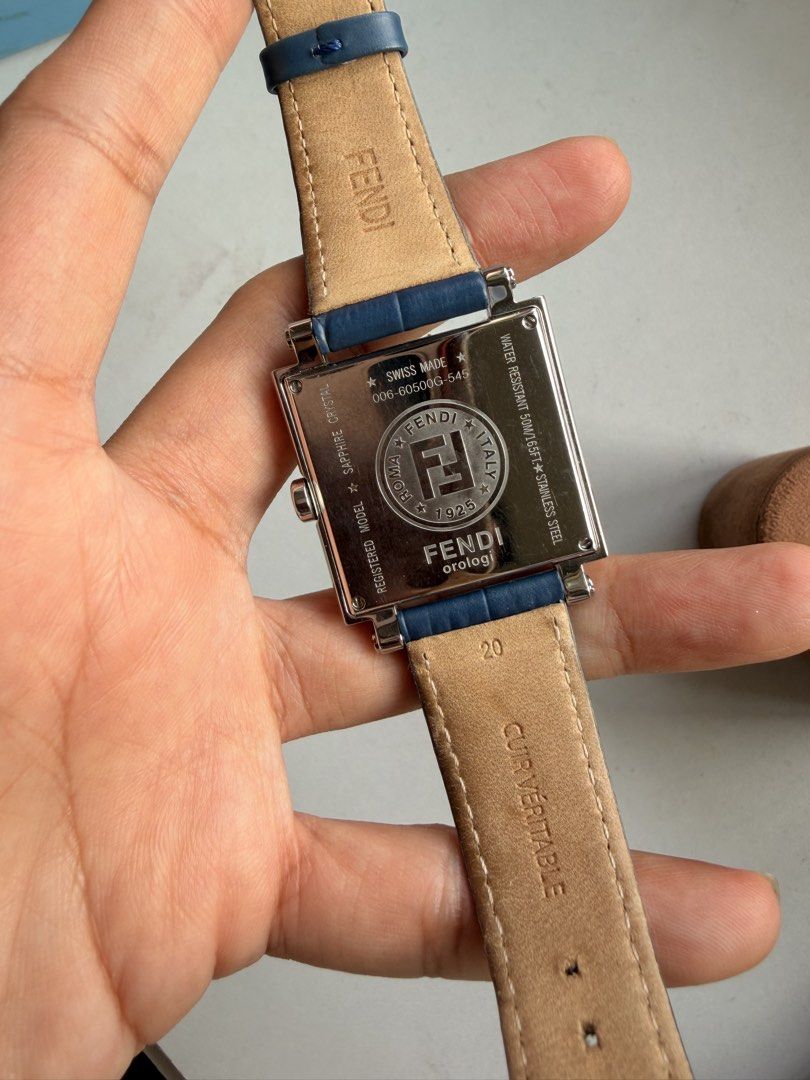 Fendi Square Dial Watch Blue Leather Strap (Category: Women's Watches) located in Las Pinas. Submitted by twiceloved24 (Listing ID 1464828593, Image 3). Description: - Brand: Fendi - Model: 006-60500G-545 (stamped on back) - Movement: Swiss made with date window at 4 o'clock - Dial: Dark blue with classic Roman numerals - Case: Stainless steel with scratch-resistant sapphire crystal - Strap: Genuine blue leather (minimal wear) - Water Resistance: