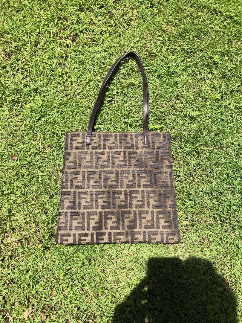 Fendi Zucca (Category: Luxury Bags & Wallets) located in La Union. Submitted by lumang__gamit00 (Listing ID 1464788368, Image 1). Description: Fendi Zucca Canvas Tote Bag featuring the iconic repeating FF monogram pattern and flat leather shoulder.