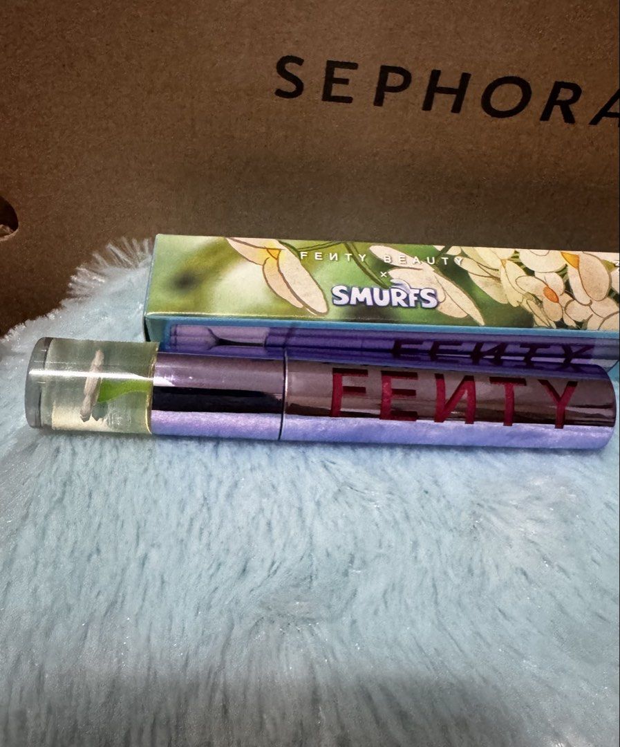 Fenty Beauty Smurfs Melon Lip Stain (Category: Makeup) located in Quezon City. Submitted by vibelane_shop (Listing ID 1464966458, Image 3). Description: - Brand: Fenty Beauty - Shade: Smurf'Melon (vibrant watermelon red) - Condition: Brand new, unopened in box - Source: Purchased straight from Sephora - Special Features: Limited edition packaging with a cute flower detail on the cap - Availability: Limited stock, grab it while you can! ❗No low ba
