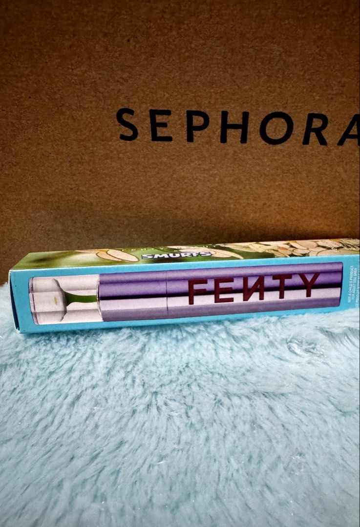 Fenty Beauty Smurfs Melon Lip Stain (Category: Makeup) located in Quezon City. Submitted by vibelane_shop (Listing ID 1464966458, Image 2). Description: - Brand: Fenty Beauty - Shade: Smurf'Melon (vibrant watermelon red) - Condition: Brand new, unopened in box - Source: Purchased straight from Sephora - Special Features: Limited edition packaging with a cute flower detail on the cap - Availability: Limited stock, grab it while you can! ❗No low ba