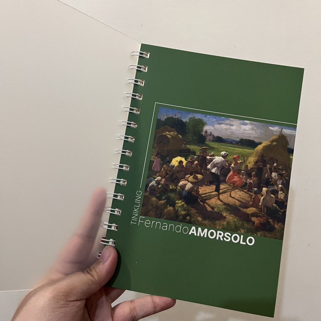 Fernando Amorsolo Tinikling Art Spiral Notebook Journal (Category: Art & Prints) located in San Pedro. Submitted by rainyydayy (Listing ID 1464871021, Image 1). Description: - Design: Features Fernando Amorsolo's famous Tinikling painting - Condition: Brand new, clean, and never written in - Cover: Durable frosted translucent front and back covers - Binding: Sturdy twin-wire binding along the side - Pages: Lined horizontally on cream-colored pape