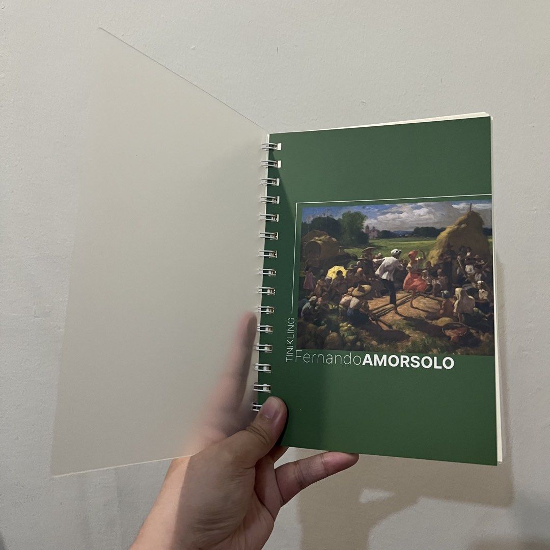 Fernando Amorsolo Tinikling Art Spiral Notebook Journal (Category: Art & Prints) located in San Pedro. Submitted by rainyydayy (Listing ID 1464871021, Image 3). Description: - Design: Features Fernando Amorsolo's famous Tinikling painting - Condition: Brand new, clean, and never written in - Cover: Durable frosted translucent front and back covers - Binding: Sturdy twin-wire binding along the side - Pages: Lined horizontally on cream-colored pape