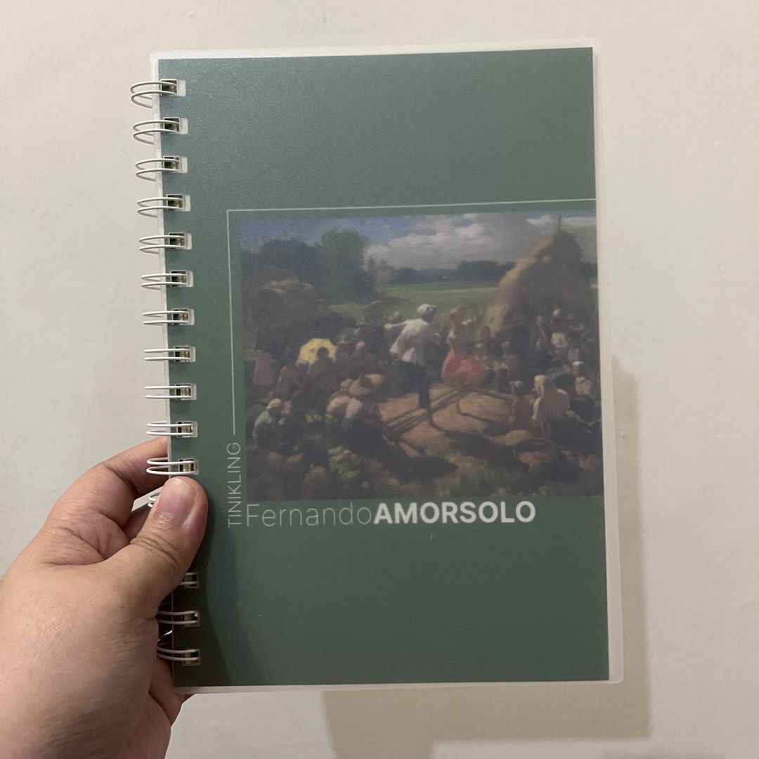 Fernando Amorsolo Tinikling Art Spiral Notebook Journal (Category: Art & Prints) located in San Pedro. Submitted by rainyydayy (Listing ID 1464871021, Image 2). Description: - Design: Features Fernando Amorsolo's famous Tinikling painting - Condition: Brand new, clean, and never written in - Cover: Durable frosted translucent front and back covers - Binding: Sturdy twin-wire binding along the side - Pages: Lined horizontally on cream-colored pape