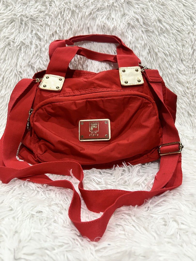 Fila Red Bag (Category: Cross-body Bags) located in Pasig City. Submitted by minminreyn (Listing ID 1464799810, Image 1). Description: Fila red bag Ok naman ang labas at loob ng tahi no tastas no butas Ok Strap at handle no Tastas Kumpleto ang zipper puller lahat naka Fila gumagana lahat ng zipper Sign of Used natural sa preloved ,faded hardware Pwede na pangharabas Cavite or Qc Loc Jnt or Lalamove.