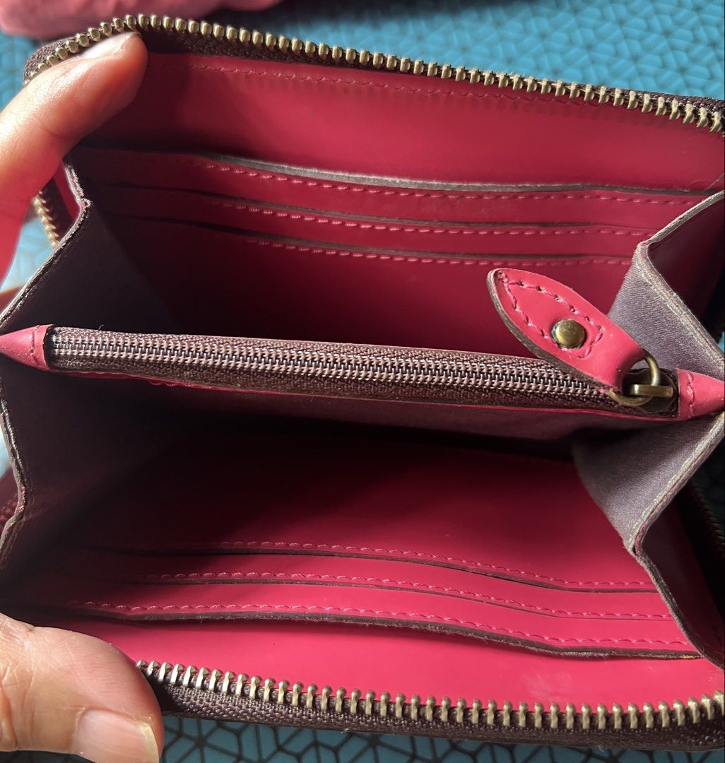 Fino Leatherware Pink Zip Around Wallet (Category: Wallets & Card holders) located in Baguio. Submitted by destashglam (Listing ID 1464792747, Image 3). Description: - Brand: Fino Leatherware - Color: Bright pink - Material: Smooth leather with gold brand plaque - Closure: Secure zip-around - Interior: Multiple card slots and a zipped coin pocket - Exterior: Back stitched slip pocket -medium size - Condition: Minor scuffs from use.