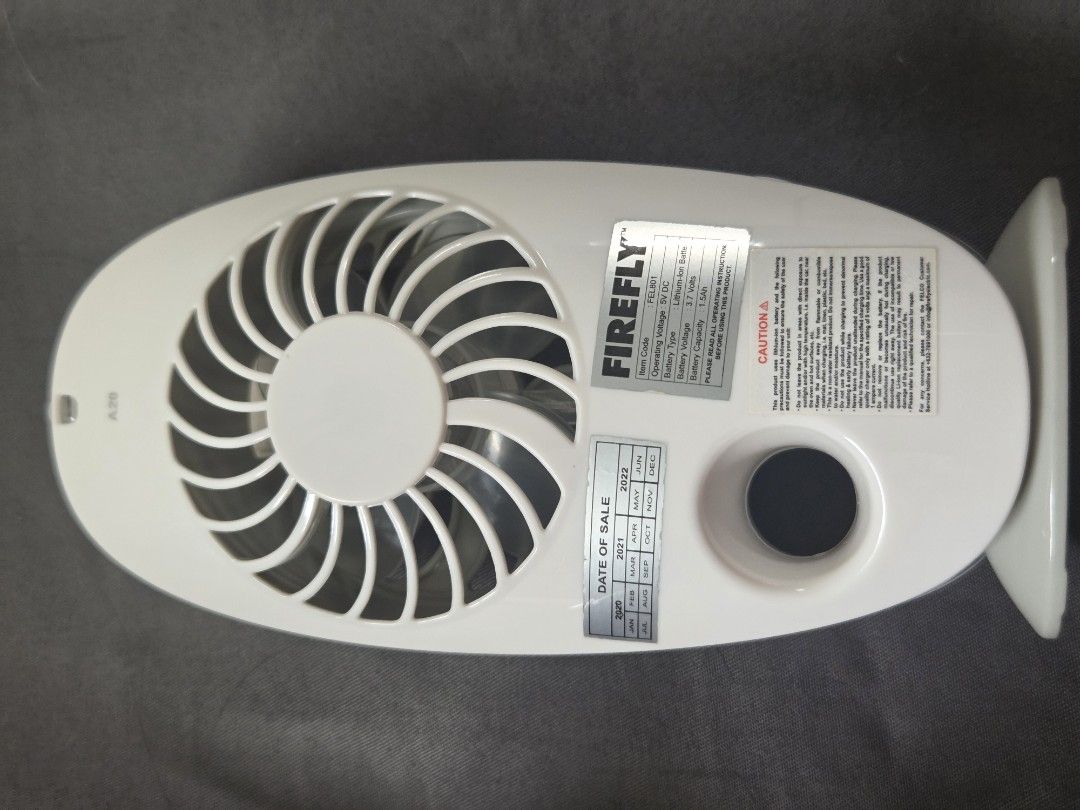 Firefly 3-Inch Mini Mist Fan FEL801 (Category: Fans) located in Santa Rosa. Submitted by prelovvdd (Listing ID 1464797078, Image 2). Description: - Model: Firefly FEL801 (3-inch mini mist fan) - Color: White body with sleek grey fan blades - Battery: Built-in rechargeable lithium-ion battery - Safety: Overcharge and overdischarge protection included - Condition: Comes with original retail box.