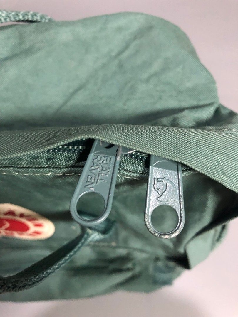 Fjällräven Kånken Backpack Green (Category: Backpacks) located in Manila. Submitted by j_fnds.dvo (Listing ID 1464885593, Image 3). Description: - Authentic Fjällräven Kånken backpack - Color: Muted Green - Classic square design with dual top handles and adjustable shoulder straps - Secure main zipper closure that opens wide for easy packing - Handy front zippered pocket for quick-access items - Features the iconic circular logo patch on the fron