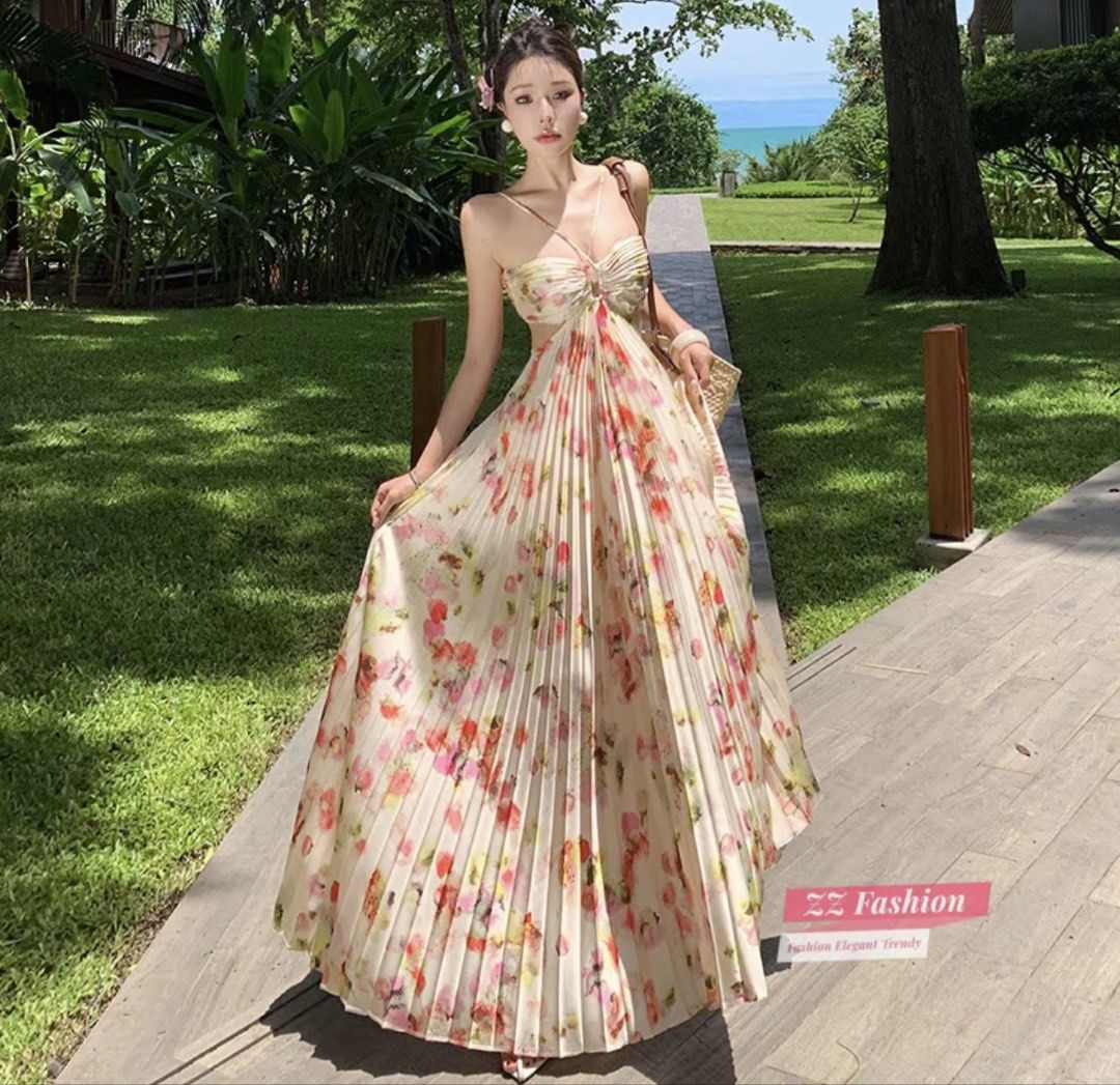 Floral Pleated Spaghetti Strap Maxi Dress (Category: Dresses) located in Mabalacat. Submitted by dameetph (Listing ID 1464876132, Image 1). Description: - Style: Long pleated maxi dress with chic waist cutouts - Design: Cream base with vibrant all-over floral print - Details: Spaghetti straps and adjustable halter necktie - Fabric: Lightweight, breezy, and flows down to the ankles - Perfect for: Beach trips, vacations, and warm weather outings.