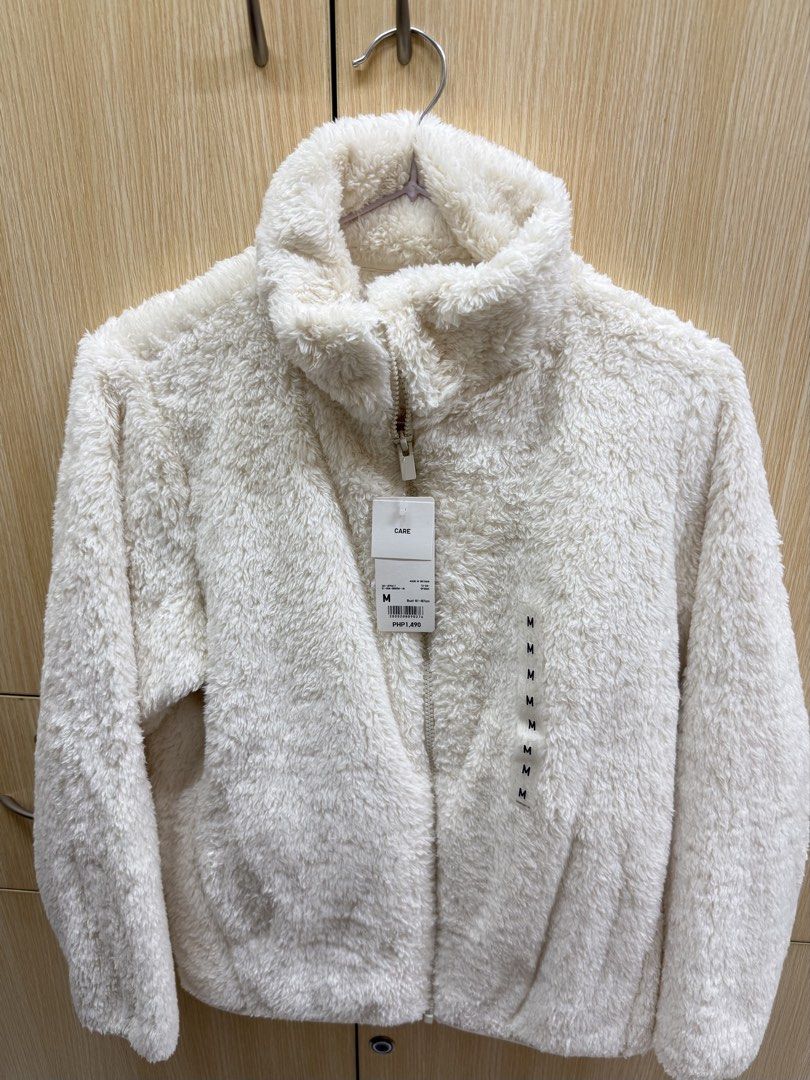 Fluffy Yarn Fleece Full Zip Jacket (Off-White) (Category: Coats, Jackets and Outerwear) located in Rizal. Submitted by jinjeonkook (Listing ID 1464855910, Image 3). Description: - Fluffy cream fleece jacket - High collar with full zip closure - Soft, warm, and perfect for cold weather layering Retails for 1,490 pesos. Shipping fee must be shouldered by the buyer. Never used. Brand new with tag. Rfs: decluttering.