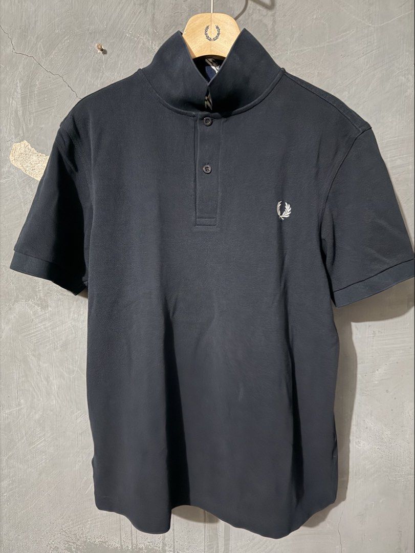 Fred Perry x Carl Jan Cruz (Category: Tshirts & Polo Shirts ) located in Makati City. Submitted by homme.boy.plus (Listing ID 1464691370, Image 1). Description: Fred Perry x Carl Jan Cruz Navy Blue Medium 20 x 24 cotton piqué Special chest embroidery and striped fabric accent on the back collar Limited Excellent, well-maintained.