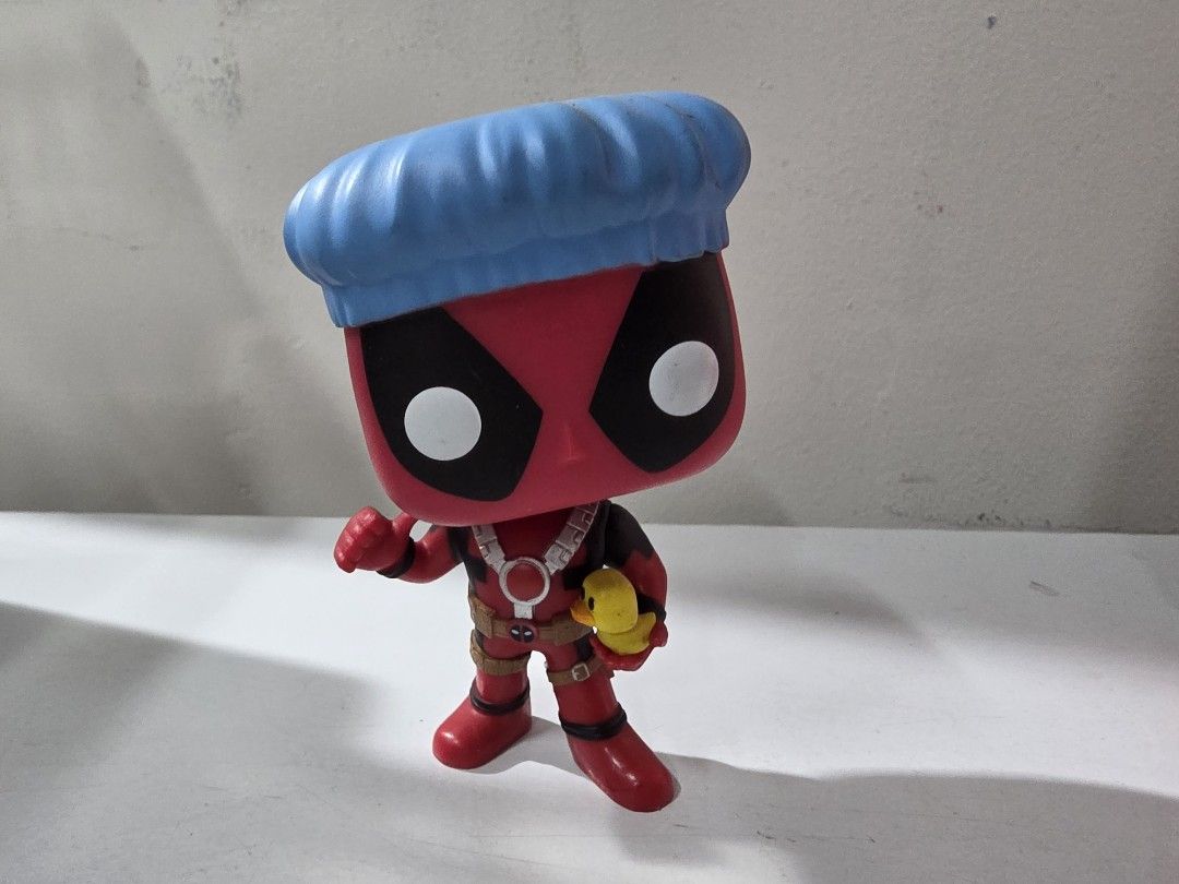Funko Pop Deadpool #114 (Category: Figurines & Statues) located in Manila. Submitted by silienat (Listing ID 1464809712, Image 1). Description: - Character: Deadpool (Blue Shower Cap & Rubber Duck) - Condition: Loose figure, no original box included - Details: Features red suit with harness details, stands on its own - Ideal for: Marvel collectors and Deadpool fans - Shipping: Ships securely from a trusted Carousell seller.