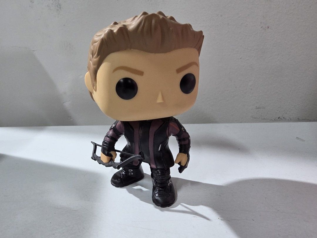 Funko Pop Marvel Avengers Hawkeye #70 (Category: Figurines & Statues) located in Manila. Submitted by silienat (Listing ID 1464809884, Image 1). Description: - Character: Hawkeye from Avengers - Size: Around 4 inches tall - Design: Features signature bow, detailed black and purple suit, and oversized head style - Condition: Loose piece without packaging, clean vinyl body with no major scuffs or marks - Ideal for: Marvel collectors and display.