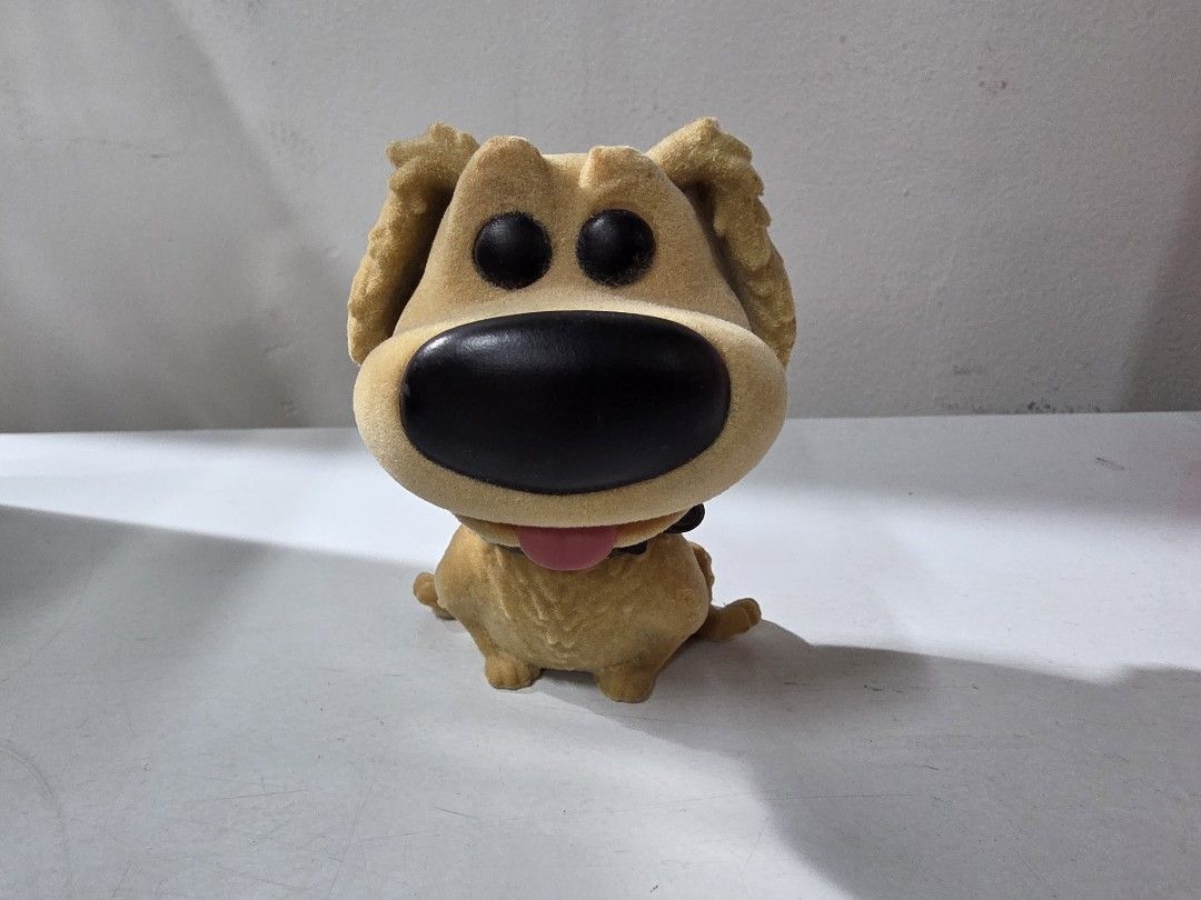 Funko Pop Up! Dug Flocked Figure #201 (Category: Designer & Blind Box Toys) located in Manila. Submitted by silienat (Listing ID 1464809601, Image 1). Description: - Official Disney Pixar Up Dug character figurine - Features a soft, flocked fuzzy texture with detailed fur - Cute bobblehead design with a big black nose and pink tongue - Stands firmly on its own for easy display - Perfect collectible for animation fans and Up lovers NO BOX.