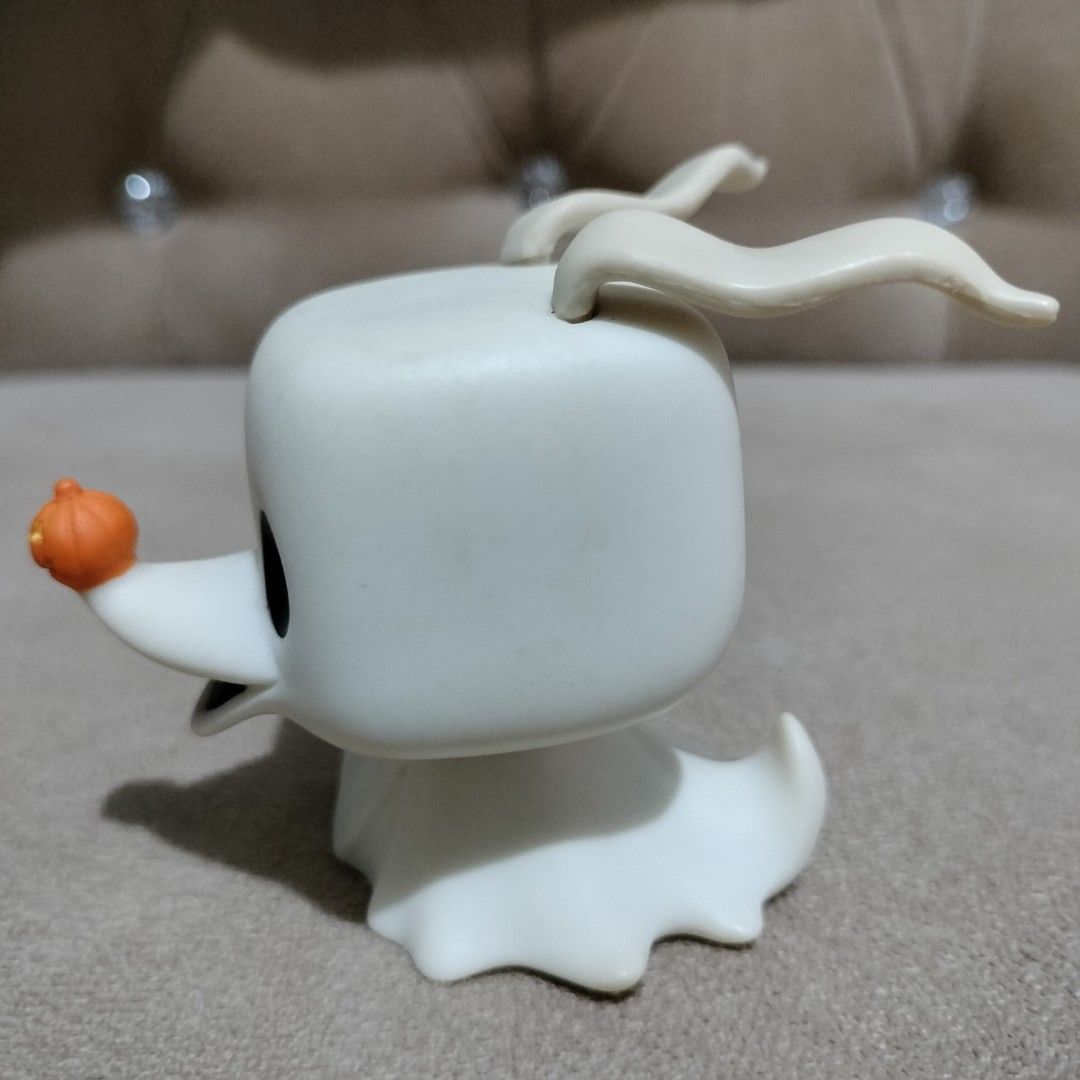 Funko Pop Zero The Nightmare Before Christmas Vinyl Figure (Category: Designer & Blind Box Toys) located in Imus. Submitted by viaysthriftshop (Listing ID 1464836057, Image 3). Description: - Character: Zero from The Nightmare Before Christmas - Details: White ghost body, floppy ears, and pumpkin nose - Condition: Loose vinyl figure, clean with no scuffs or marks - Note: Does not include original packaging - Perfect for display and Funko collecto