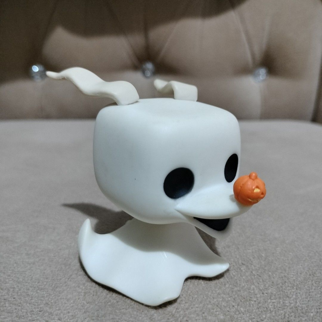 Funko Pop Zero The Nightmare Before Christmas Vinyl Figure (Category: Designer & Blind Box Toys) located in Imus. Submitted by viaysthriftshop (Listing ID 1464836057, Image 1). Description: - Character: Zero from The Nightmare Before Christmas - Details: White ghost body, floppy ears, and pumpkin nose - Condition: Loose vinyl figure, clean with no scuffs or marks - Note: Does not include original packaging - Perfect for display and Funko collecto