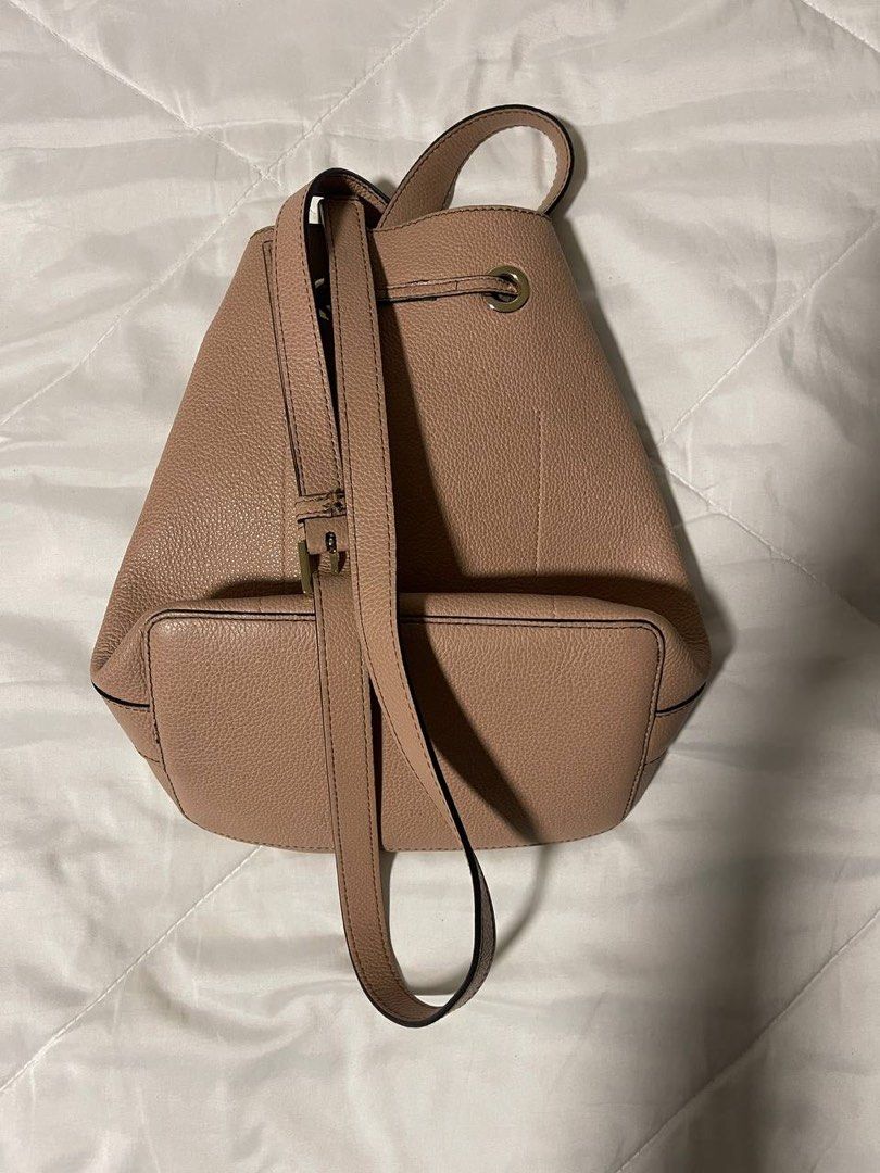 Furla Pink Leather Bucket Bag Backpack Convertible (Category: Luxury Bags & Wallets) located in Paranaque City. Submitted by prelovedfrompat (Listing ID 1464916144, Image 2). Description: - Authentic Furla pink leather bucket bag - Premium textured pebbled leather with gold-tone hardware - Secure drawstring closure - Soft suede interior lining with a handy slip pocket - Convertible straps for shoulder bag or backpack styling - Versatile blush neu