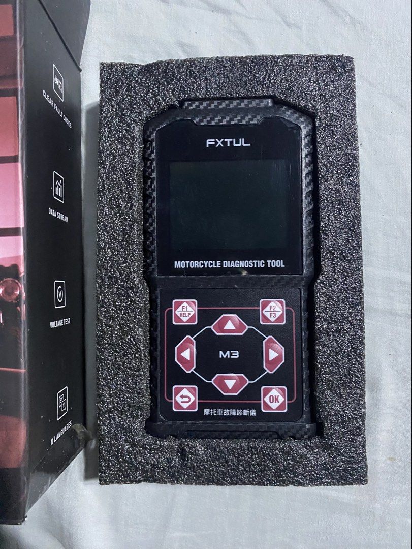 FXTUL M3 Motorcycle Diagnostic Tool Scanner (Category: Bicycles) located in Iba. Submitted by leovincee.1414 (Listing ID 1464910663, Image 1). Description: - FXTUL M3 motorcycle diagnostic scanner - Clears fault codes, reads live data streams, and checks battery voltage - Supports 11 languages for easy navigation - Includes main handheld unit, multiple diagnostic adapter cables, user manual, and original retail box - Perfect for DIY mechanics and