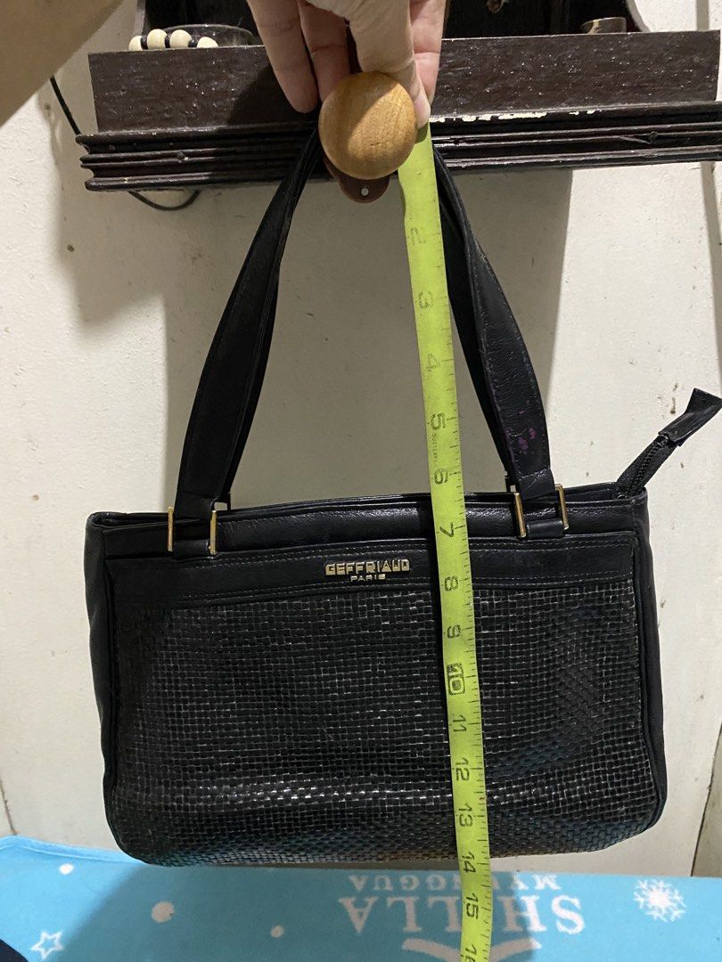 Geffriaud Paris Black Woven Leather Handbag (Category: Luxury Bags & Wallets) located in Manila. Submitted by resi.diaz (Listing ID 1464873335, Image 3). Description: - Brand: Geffriaud Paris - Color: Classic Black - Design: Stylish woven texture detail on the lower front with gold branding stamp - Straps: Dual structured shoulder straps with elegant gold-tone hardware links - Closure: Secure zipper top closure - Condition: Excellent/Well-maintai