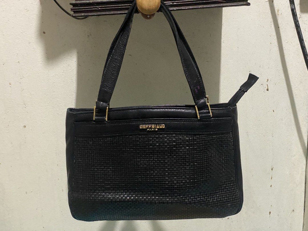 Geffriaud Paris Black Woven Leather Handbag (Category: Luxury Bags & Wallets) located in Manila. Submitted by resi.diaz (Listing ID 1464873335, Image 1). Description: - Brand: Geffriaud Paris - Color: Classic Black - Design: Stylish woven texture detail on the lower front with gold branding stamp - Straps: Dual structured shoulder straps with elegant gold-tone hardware links - Closure: Secure zipper top closure - Condition: Excellent/Well-maintai