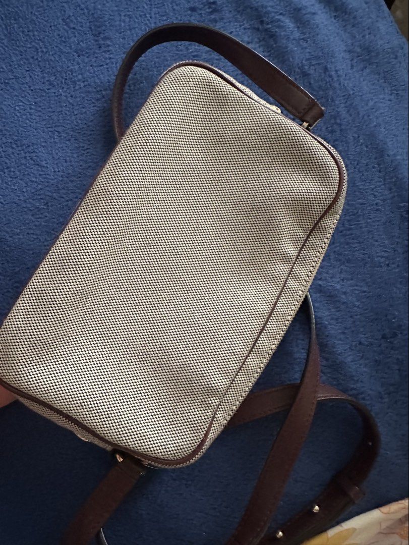 Givenchy Camera Bag (Category: Luxury Bags & Wallets) located in Antipolo. Submitted by prelovedcloseta (Listing ID 1464776910, Image 2). Description: - Authentic Givenchy Bond Camera Bag - Material: Durable canvas with dark brown leather trim and piping - Branding: Iconic Givenchy Paris logo printed on the front - Closure: Secure top zip closure - Strap: Comfortable dark brown leather crossbody strap - Size: Compact and handy, perfect for daily 