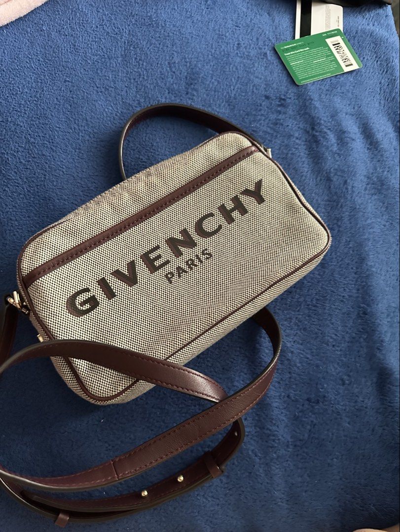 Givenchy Camera Bag (Category: Luxury Bags & Wallets) located in Antipolo. Submitted by prelovedcloseta (Listing ID 1464776910, Image 1). Description: - Authentic Givenchy Bond Camera Bag - Material: Durable canvas with dark brown leather trim and piping - Branding: Iconic Givenchy Paris logo printed on the front - Closure: Secure top zip closure - Strap: Comfortable dark brown leather crossbody strap - Size: Compact and handy, perfect for daily 