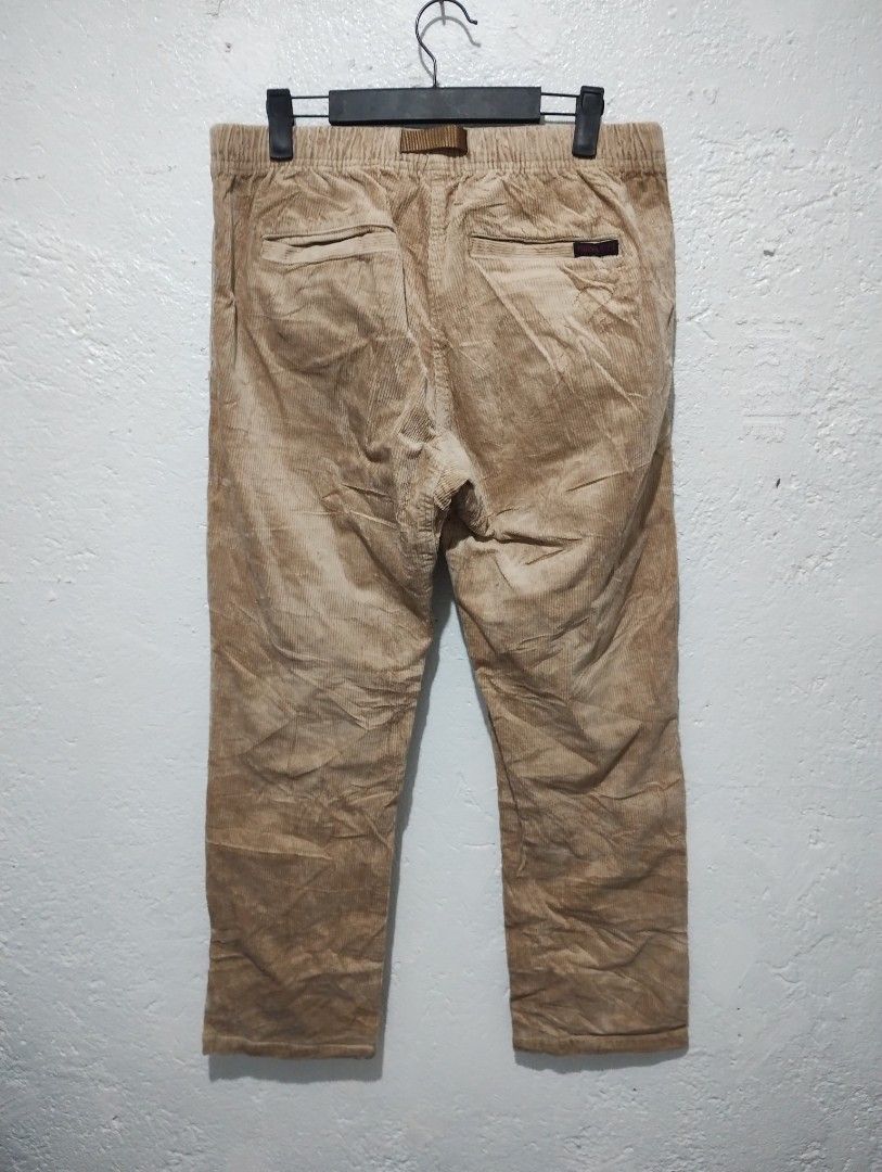 Gramicci Corduroy Pants Tan Size M (Category: Trousers) located in Imus. Submitted by darylg88358770 (Listing ID 1464898014, Image 3). Description: - Brand: Gramicci - Item: Corduroy Pants - Color: Tan - Size: Asia L (USA/EU M) - Fit: Relaxed fit with comfortable elastic waistband - Features: Integrated climbing belt, button-closure back pockets, and iconic brand label tag - Material: 98% cotton, 2% polyurethane - Condition: Brand new / Excellent