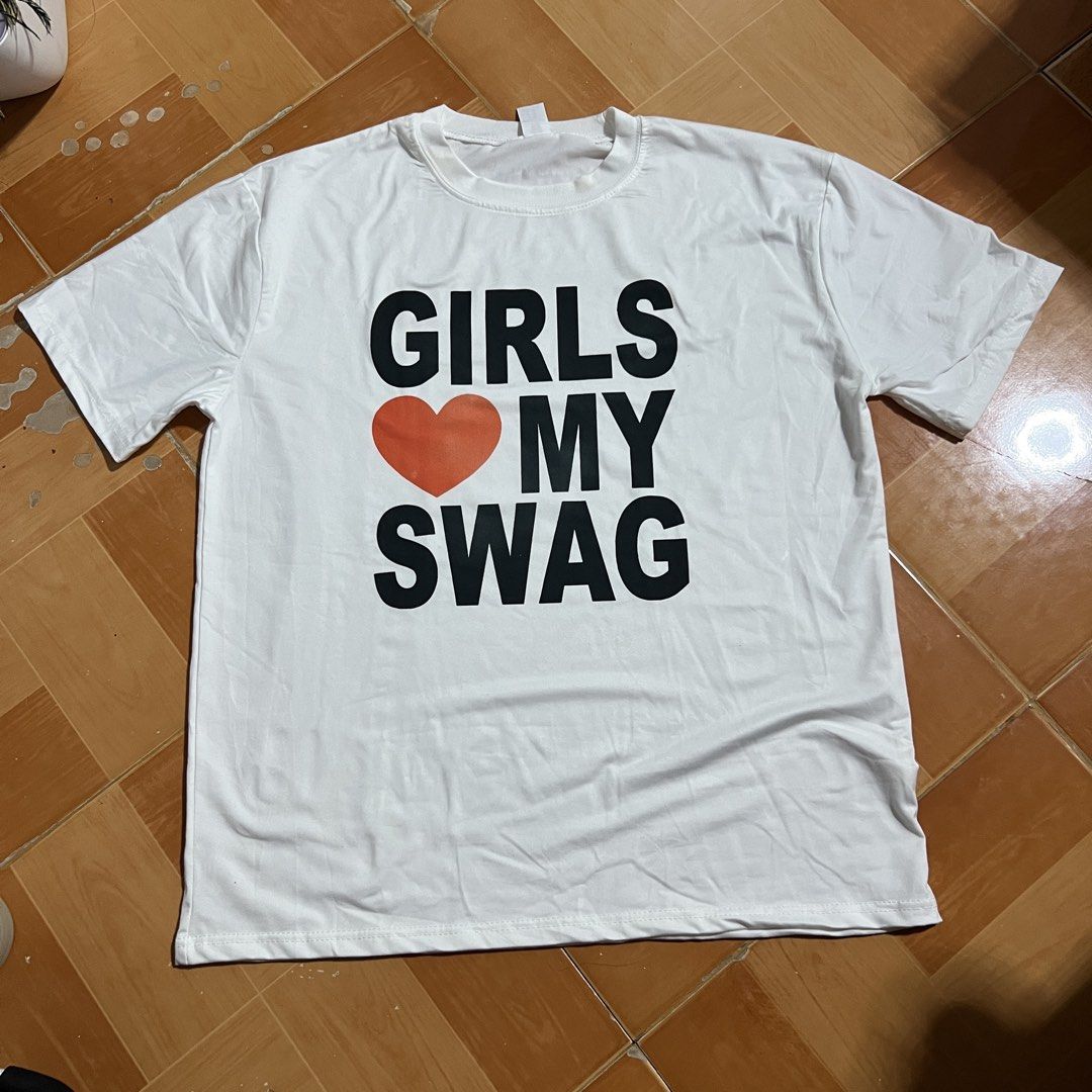 Graphic tshirt (Category: Shirts) located in Imus. Submitted by yanaxiesights (Listing ID 1464874483, Image 3). Description: 𑣲⋆ ‘girls love my swag’ graphic shirt (unisex) ! 𑣲⋆ used once, makeup stains on collar (washable) rfs: decluttering — ᨳଓ . lalamove, strictly payment first ! 📍 Cavite.