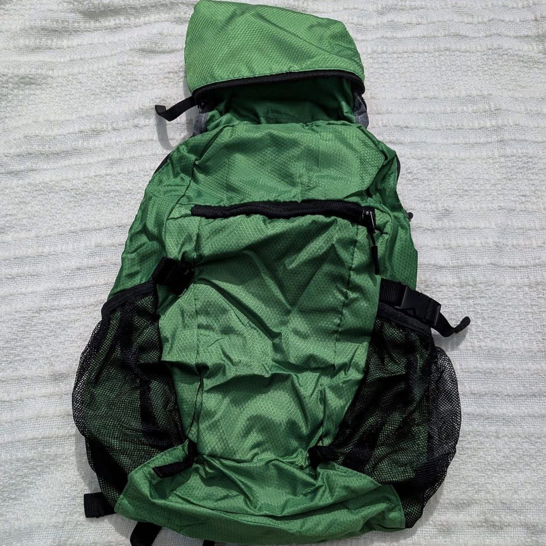 Green Foldable Packable Lightweight Daypack Travel Backpack (Category: Hiking & Camping) located in Iba. Submitted by leovincee.1414 (Listing ID 1464796790, Image 1). Description: - Color: Green - Material: Lightweight ripstop - Design: Folds completely flat into its own compact pouch - Features: Mesh side pockets, adjustable shoulder straps, and front zip pocket - Ideal for: Hiking, cycling, and travel.