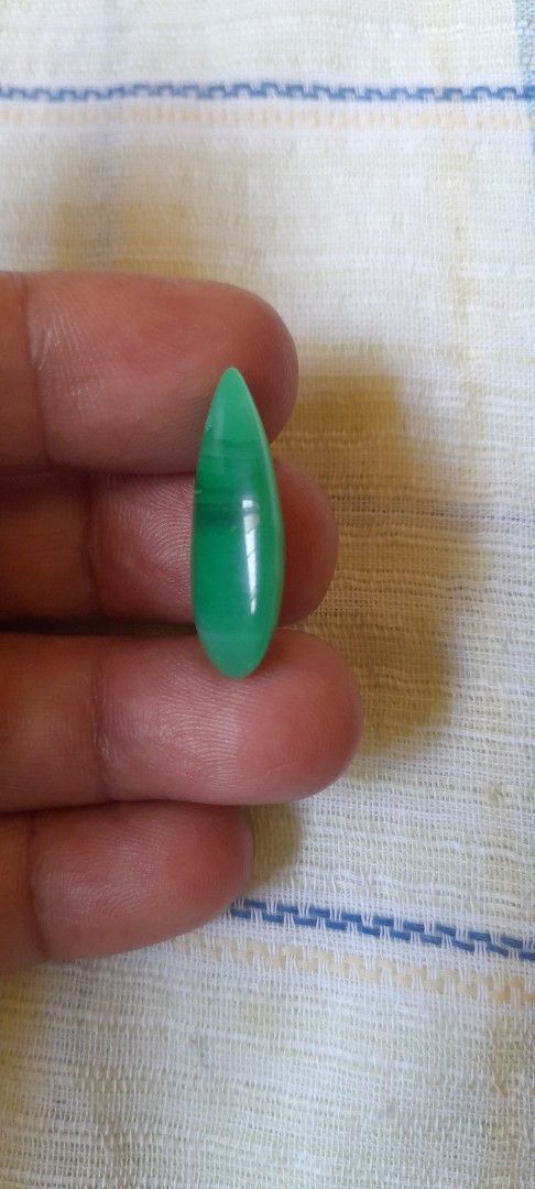 Green tear drop jade pendant (Category: Necklaces) located in Bocaue. Submitted by marajapansurplus (Listing ID 1464773993, Image 3). Description: - Stunning green teardrop stone pendant - Pre-drilled hole near the top for easy hanging on a cord or chain - Smooth, polished finish showcasing unique natural banding and color variations - Lightweight design that is comfortable to wear - Ideal for DIY jewelry making and custom accessories.