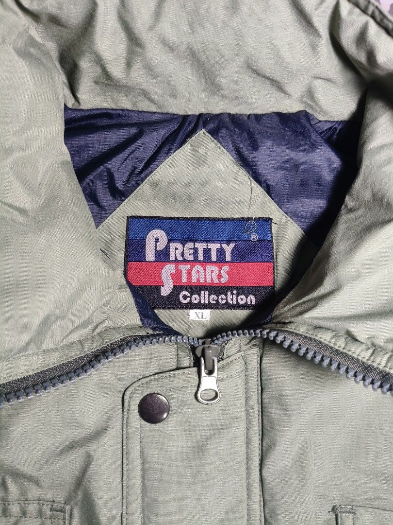 Green Utility Puffer Jacket Vest (Category: Coats, Jackets and Outerwear) located in Lapu Lapu. Submitted by hooman422 (Listing ID 1464914709, Image 2). Description: • Style: Multi-pocket utility or tactical gilet vest. • Color: Light sage green or olive drab. • Material: Lightweight, durable synthetic nylon or polyester fabric. • Closure: Front zipper closure with a buttoned storm flap. • Collar: High stand-up mock neck collar. • Pockets: Featur