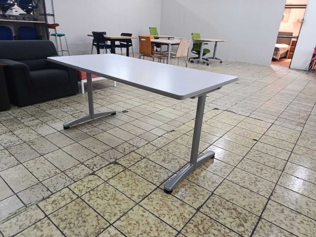 Grey Office Meeting Table Study Desk (Category: Office Furniture & Fixtures) located in Quezon City. Submitted by kevinmacabata12997160 (Listing ID 1464825603, Image 2). Description: - Tabletop Color: Solid grey - Frame: Sturdy metal T-legs - Design: Clean lines and simple rectangular shape - Features: Plenty of legroom underneath, neutral color fits most interiors - Ideal For: Workspace setups, meeting rooms, or home studies - Fulfillment: Pick 