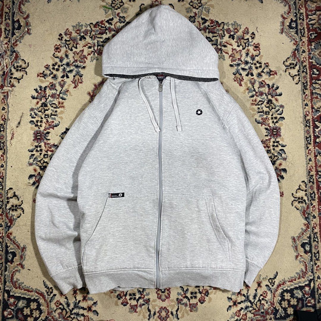 Grey Zip-Up Hoodie with Drawstrings and Pockets (Category: Coats, Jackets and Outerwear) located in Manila. Submitted by thrifturfit_star (Listing ID 1464938006, Image 1). Description: - Color: Grey - Material: Soft and cozy fleece - Design: Full front zipper with adjustable hood drawstrings - Pockets: Convenient front kangaroo pockets - Details: Small printed chest logo and patch tag on the pocket edge - Fit: Ribbed cuffs and hem to maintain sha