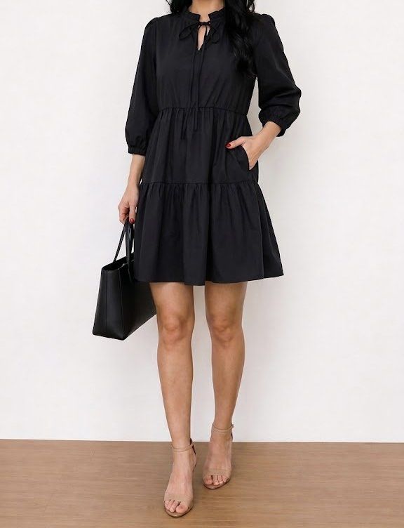 GU black tiered dress (Category: Dresses) located in Cabanatuan. Submitted by tal_0000 (Listing ID 1464868675, Image 1). Description: - Color: Black - Design: Tiered dress with a dropped waistline and above-the-knee length - Sleeves: Mid-length with elastic cuffs - Neckline: Ruffle collar with front tie string.
