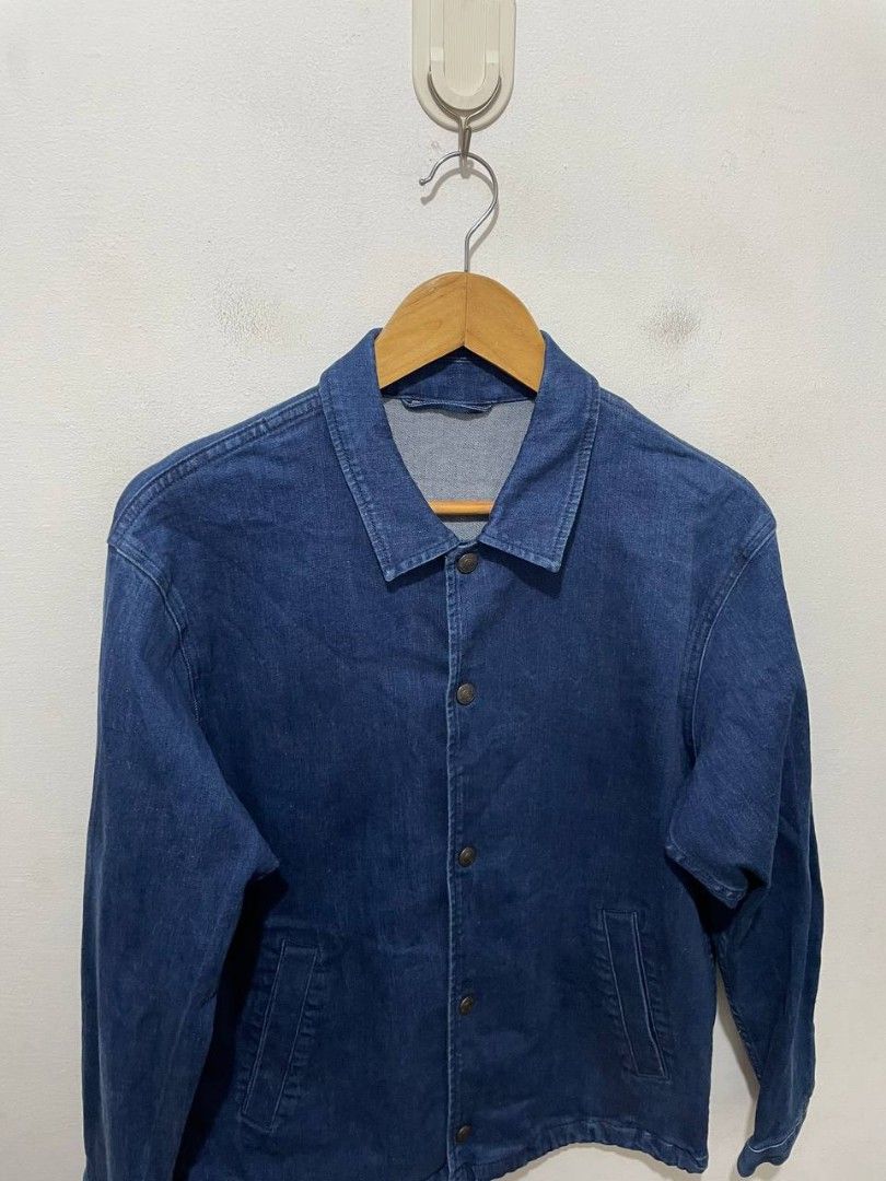 GU Denim Coach Jacket Blue Size S (Category: Coats, Jackets and Outerwear) located in Caloocan City. Submitted by alysoncala70121 (Listing ID 1464864281, Image 2). Description: - Brand: GU - Style: Denim coach jacket - Color: Dark blue wash - Size: S - Material: 99% cotton, 1% spandex - Closure: Snap button front with metal hardware - Pockets: Two front slant pockets - Hem: Adjustable drawstring - Condition: Clean inside and out.