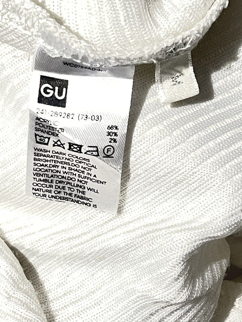GU Ribbed V-Neck Sweater White Size M (Category: Longsleeves) located in Donsol. Submitted by saksthriftavenuebyluckymaria8 (Listing ID 1464913277, Image 3). Description: - Brand: GU - Color: OFF - White - Size: M - Style: Ribbed knit sweater with V-neckline and drop shoulder batwing sleeves - Material: 68% acrylic, 30% polyester, 2% spandex - Origin: Made in Cambodia - Care: Standard care instructions included GU, a casual wear brand owned by Fa