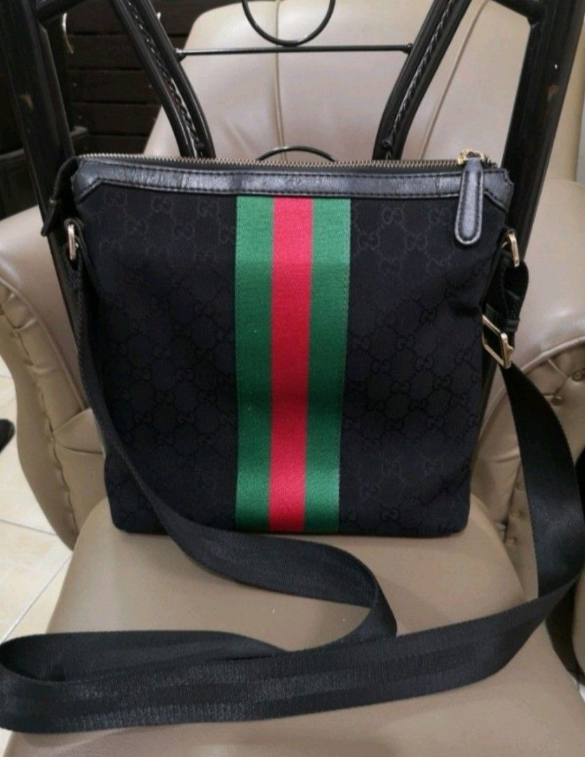 Gucci Black GG Monogram Web Stripe Messenger Bag (Category: Luxury Bags & Wallets) located in Manila. Submitted by lorenzomar99185 (Listing ID 1464903784, Image 2). Description: - Authentic Gucci messenger bag in black canvas - Iconic red and green Web stripe with all-over GG monogram - Premium black leather trim and adjustable crossbody strap - Secure top zip closure - Spacious interior with Gucci branding and serial number tag - Perfect size fo