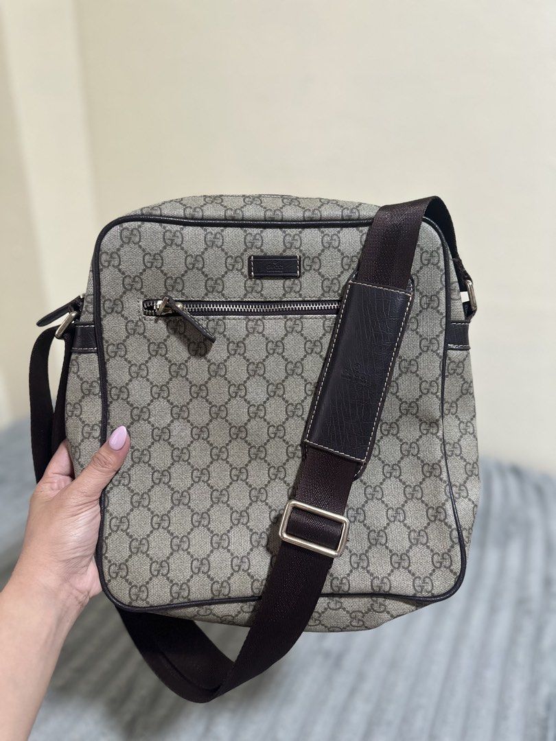 Gucci GG Supreme Canvas Messenger Bag (Category: Luxury Bags & Wallets) located in Baguio. Submitted by annecicat (Listing ID 1464776241, Image 1). Description: - Gucci messenger bag in classic GG Supreme canvas - Premium brown leather trim and durable brown fabric lining - Adjustable shoulder strap complete with a comfortable leather shoulder pad - Convenient front zip pocket for quick-access items - Secure main compartment featuring an interior