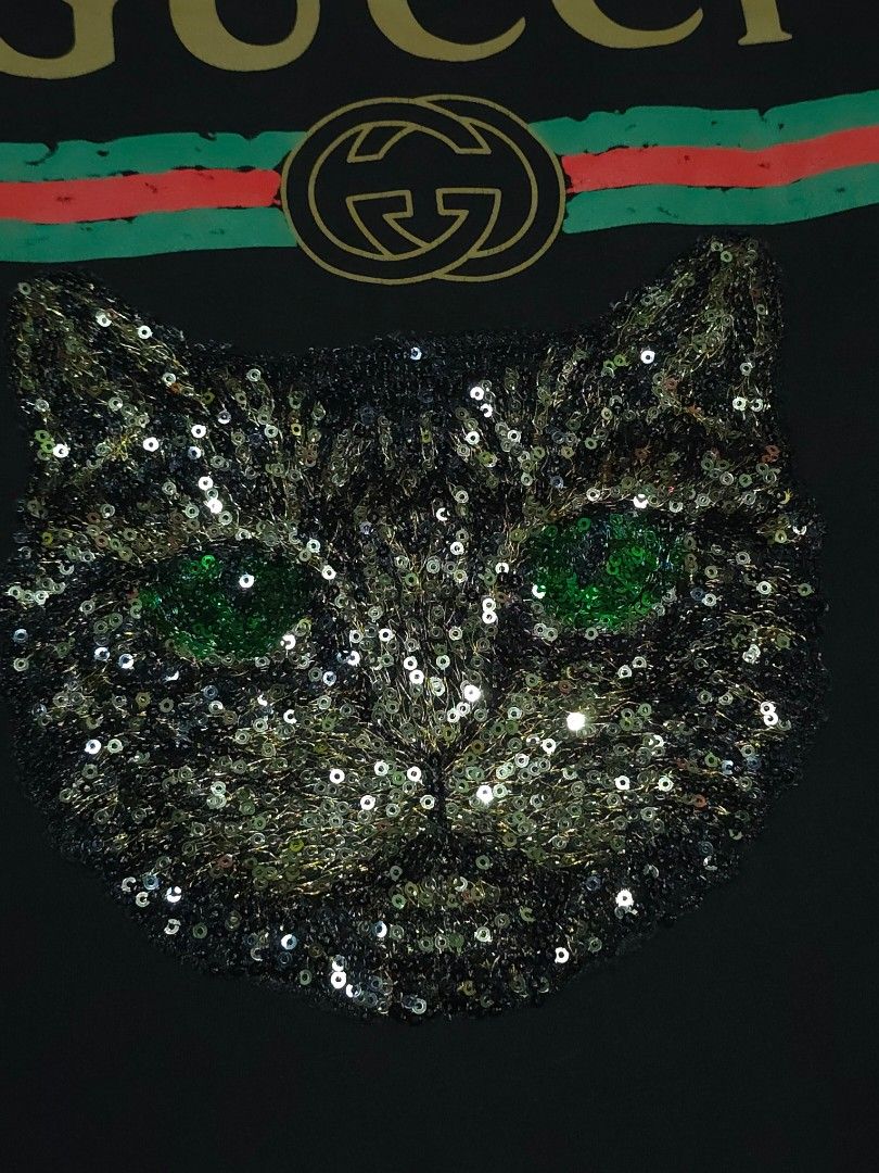 Gucci Sequin Cat (Category: Shirts) located in Abulug. Submitted by humanwhosellthings (Listing ID 1464895788, Image 3). Description: GUCCI Sequin Cat Womens Tee ✅️Size: Medium ✅️Dimes: 18W x 25.5L ✅Condition: Very Good - Excellent ✅Issue: None,missing necktag only ✅Color Rate: 9.2/10.