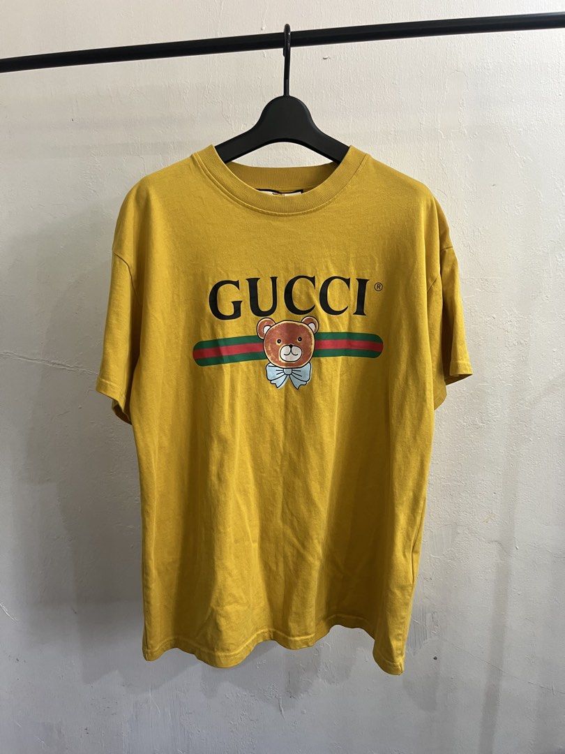 Gucci Tee (Category: Luxury Apparel) located in Virac. Submitted by _thecave (Listing ID 1464774156, Image 1). Description: Gucci Tee Good as new 9.8/10 Color Rate No Flaws Tagged Size: M Width: 21 Length: 27.