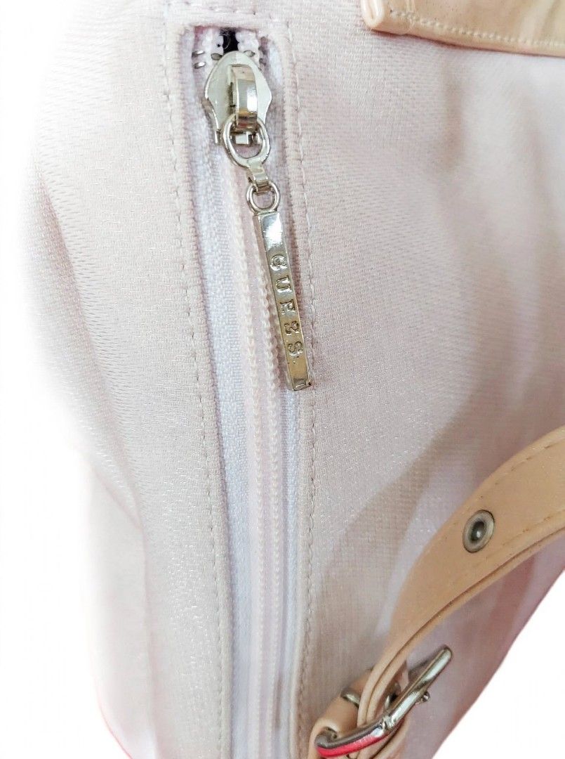 Guess light pink backpack (Category: Backpacks) located in Caloocan City. Submitted by chonadura91470 (Listing ID 1464778136, Image 2). Description: - Authentic Guess backpack in light pink - Features chic gold-tone GUESS plaque and hardware - Drawstring closure with secure magnetic snap - Adjustable patent leather-look straps and top handle - Handy zippered front pocket for small essentials - Flaw note: Shows noticeable rust stains near seams an